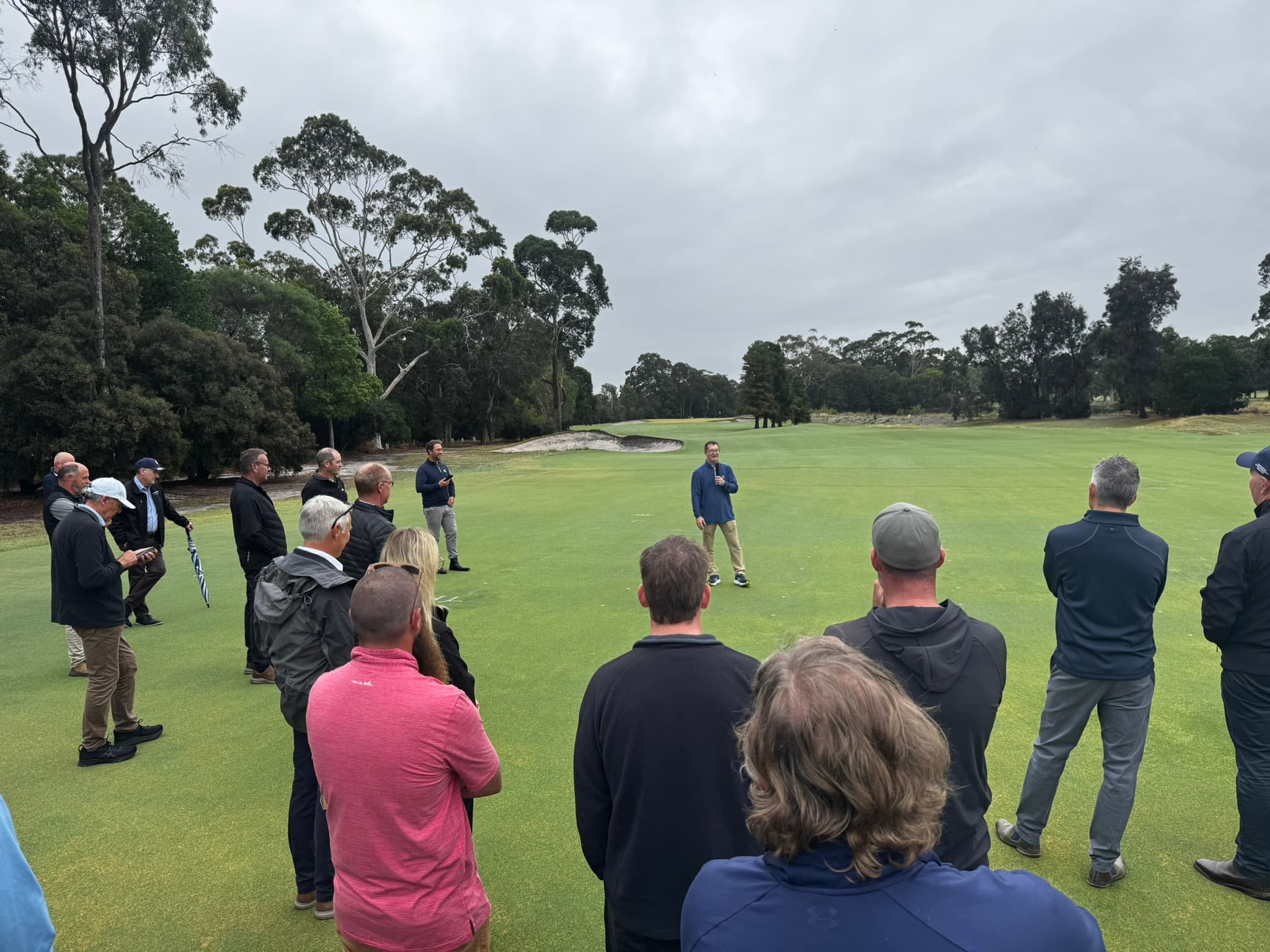 John Kaminski, Ph.D. speaking with golf course superintendents in the field